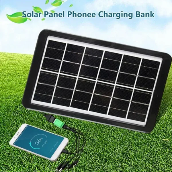 Prenosivi solarni panel za punjenje telefona raširen na travi